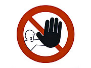 Ein Verbotsschild mit einer Figur, die ihre schwarz hervorgehobene Hand entgegen streckt